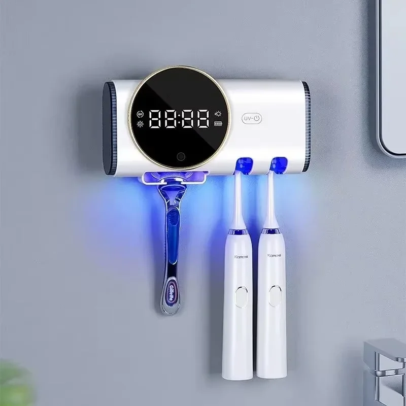 Soporte de pared UV para cepillos de dientes con dispensador de pasta y estante organizador de baño.
